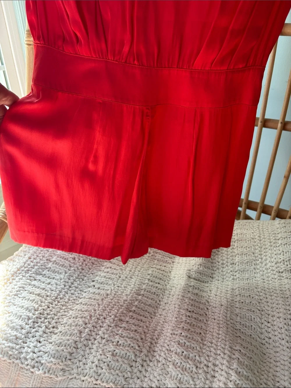 Beautiful Bebe satin vibrant red/orange romper with gold accents.